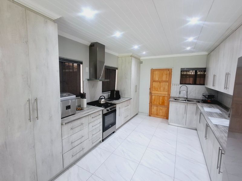 Modern, Spacious 3-Bedroom Home Perfectly Located on a Corner Stand with Endless Potential - Photo 2