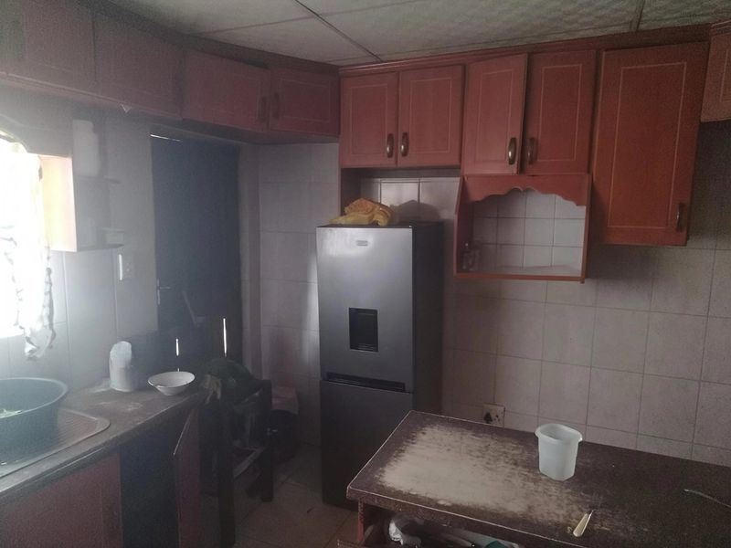 House with cherrywood kitchen, close to police station and school extra Income - Photo 10