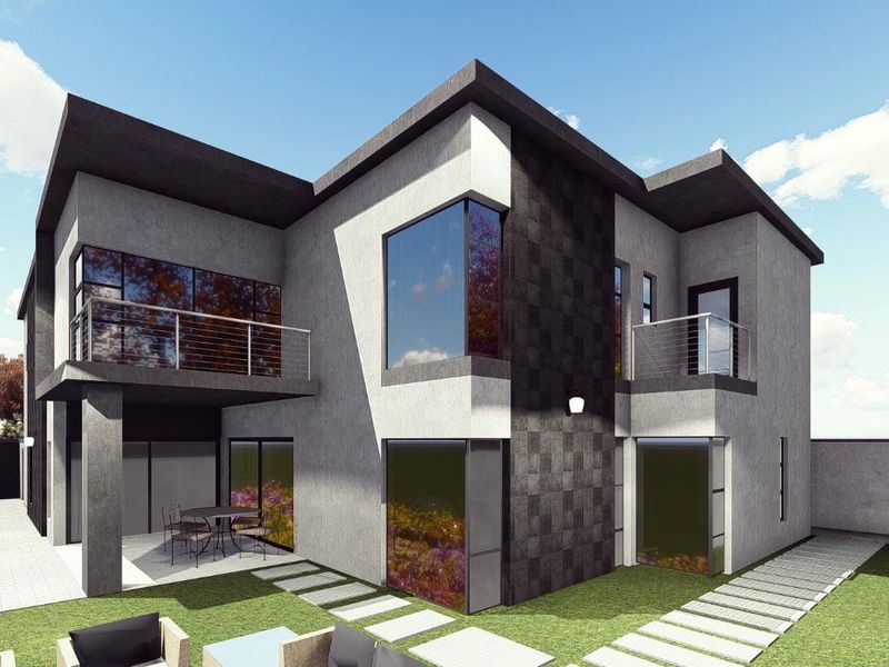 Modern double-story residential exterior featuring stone cladding, large glass windows, upper-level balconies with stainless steel railings, and a paved patio area.