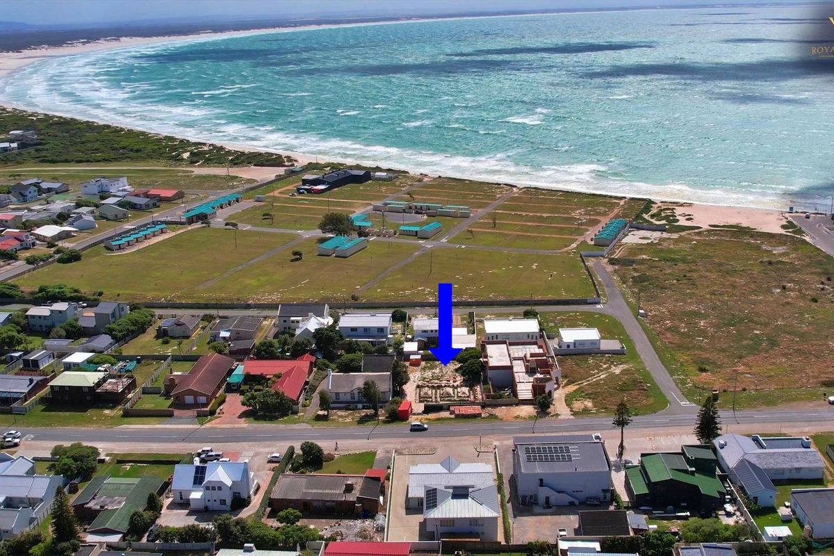 Aerial view of the coastal commercial property location, highlighting its proximity to the beach and surrounding neighborhood infrastructure.