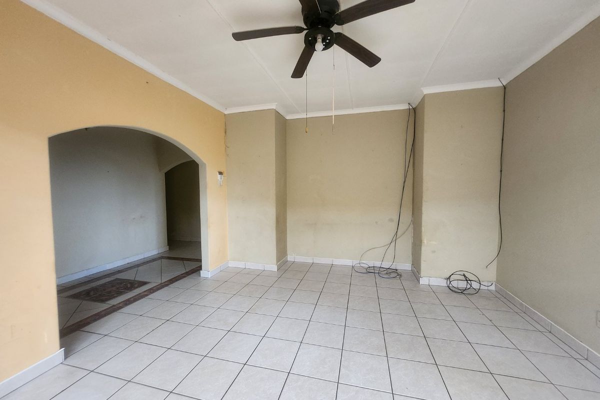 A well-designed property offering dual-living convenience and a double garage. - Photo 2