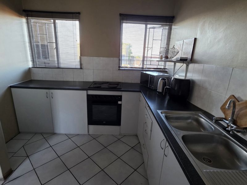 Secure Magalieskruin Townhouse with Balcony - Photo 10