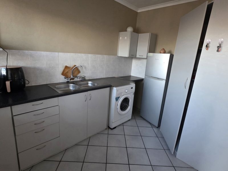 Secure Magalieskruin Townhouse with Balcony - Photo 9