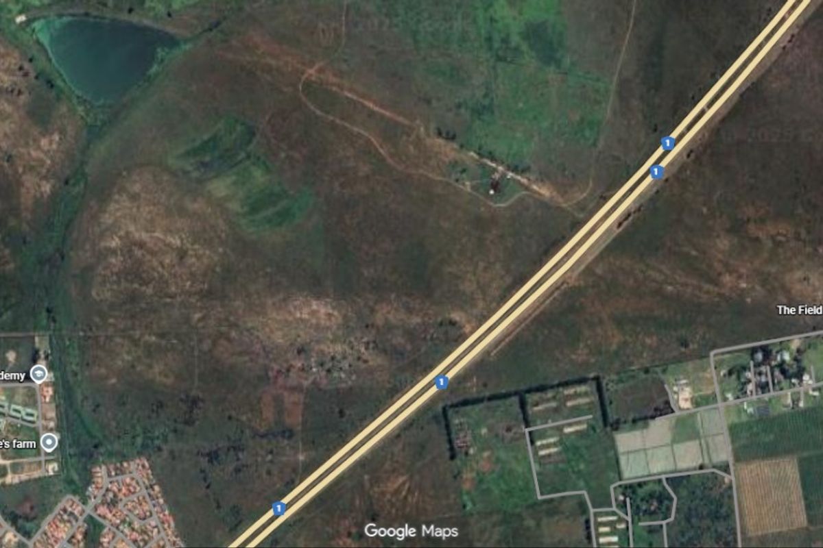 Aerial satellite view showing the vacant land parcel in relation to the surrounding highway infrastructure and local area.