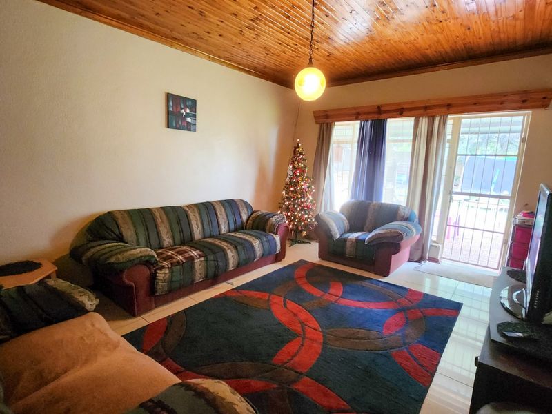 A neat three-bedroom, two-bathroom home with a double garage and a large yard for easy, comfortable living. - Photo 10