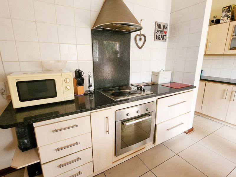 A neat three-bedroom, two-bathroom home with a double garage and a large yard for easy, comfortable living. - Photo 9