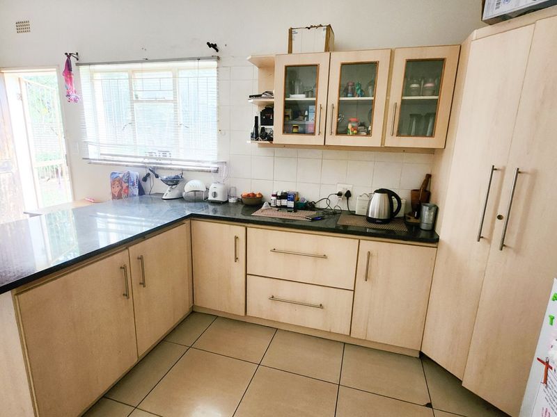 A neat three-bedroom, two-bathroom home with a double garage and a large yard for easy, comfortable living. - Photo 8