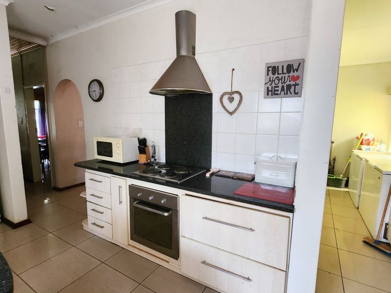 A neat three-bedroom, two-bathroom home with a double garage and a large yard for easy, comfortable living. - Photo 6