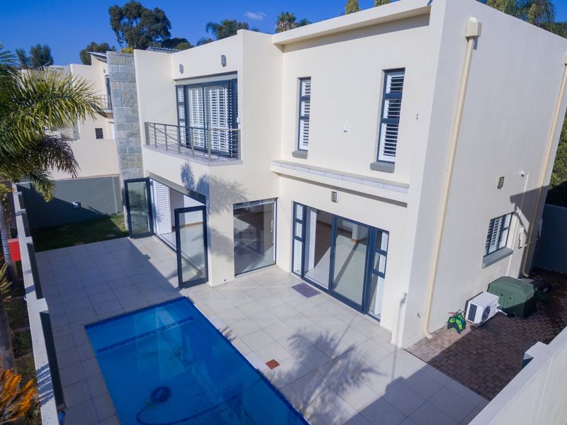 Luxury Cluster Living with Heated Pool, Solar Power & Designer Finishes - Photo 1