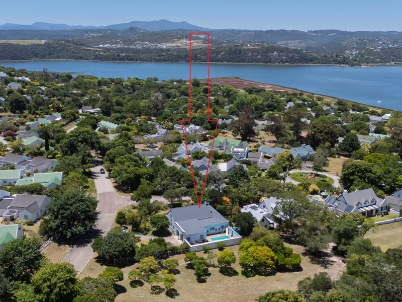 Aerial view of the property highlighting its location within the estate, featuring a private swimming pool and proximity to the lagoon.