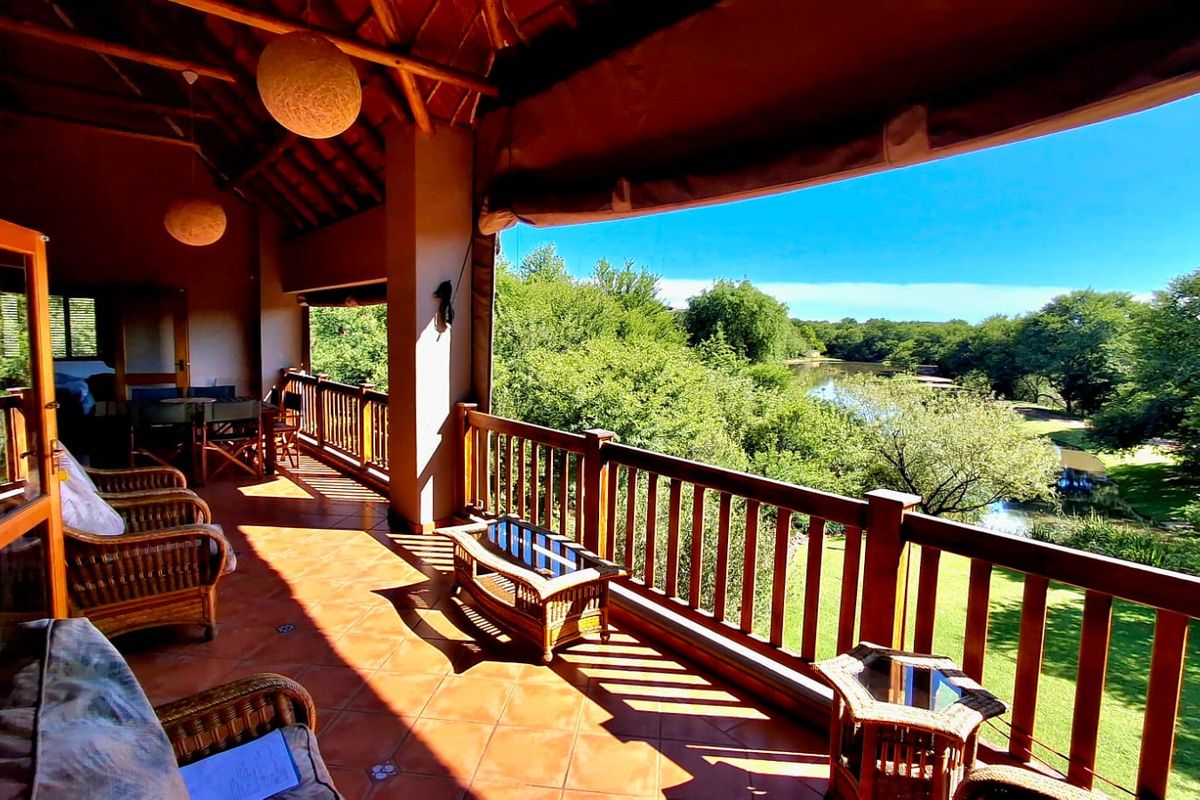 "Stunning 4-bedroom family home, priced to sell, located in the highly sought-after Boschenvaal Riverfront Lodge." - Photo 2