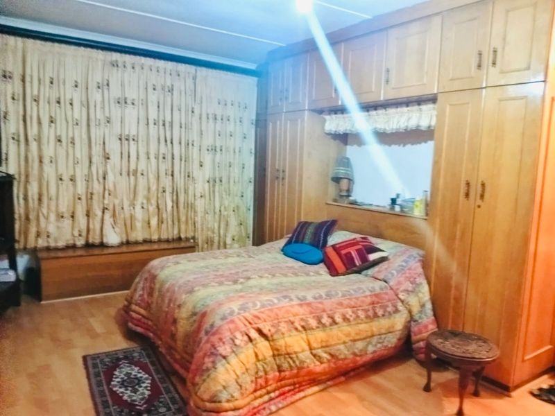 Spacious 6-Bedroom Home with Multiple Living Areas, Ample Parking and Income Potential in Reservoir Hills - Photo 10