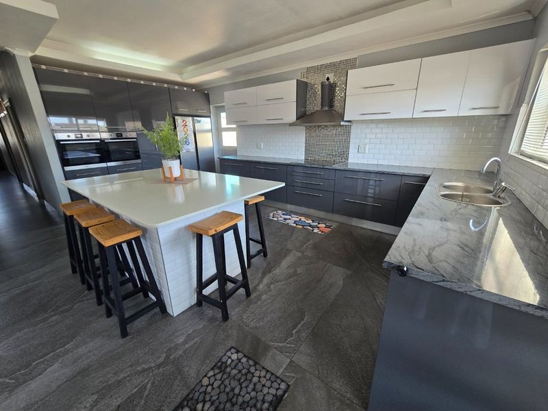 Elegant Family Home with a Statement Kitchen & Pool - Photo 7