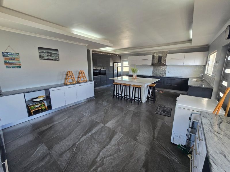 Elegant Family Home with a Statement Kitchen & Pool - Photo 6