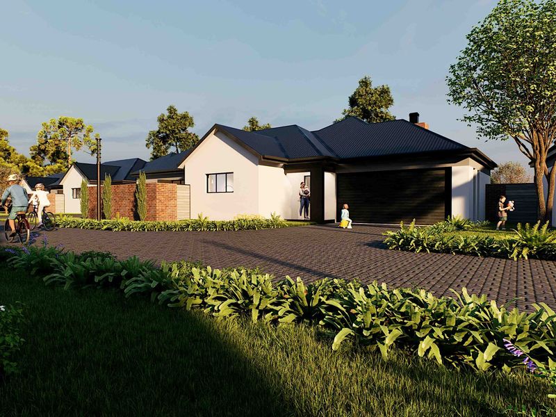 A modern residential street view featuring a well-maintained house with a paved driveway, metal roof, and landscaped garden area.