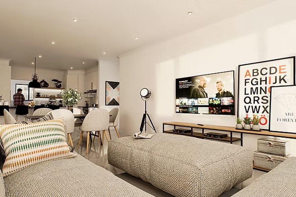 Modern open-plan living area featuring a spacious kitchen with island, recessed lighting, and tiled flooring, seamlessly flowing into the lounge space.