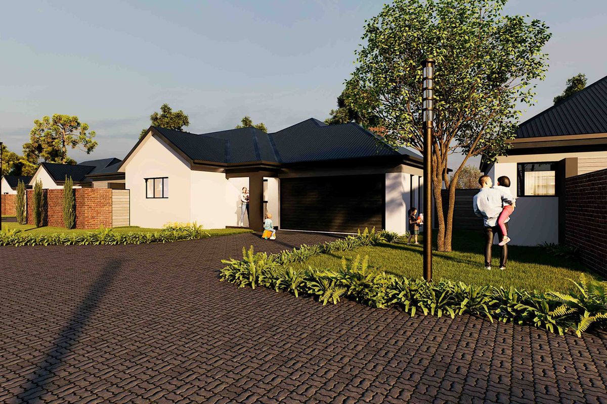 A modern residential exterior featuring a paved driveway, dark metal roofing, and a brick boundary wall, showcasing a contemporary architectural design.