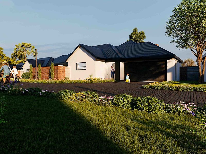 A modern residential house exterior featuring a dark metal roof, paved driveway, and well-maintained landscaped garden area.