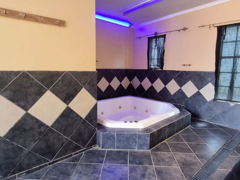 Exquisite 4-Bedroom Home with Endless Amenities and Breathtaking Gardens. - Photo 9