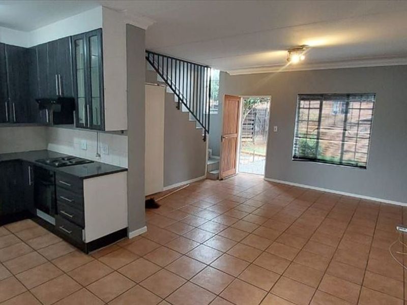 Charming Two-Bedroom Home with Practical Living Spaces - Photo 2