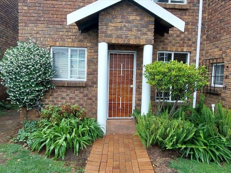Charming Two-Bedroom Home with Practical Living Spaces - Photo 1