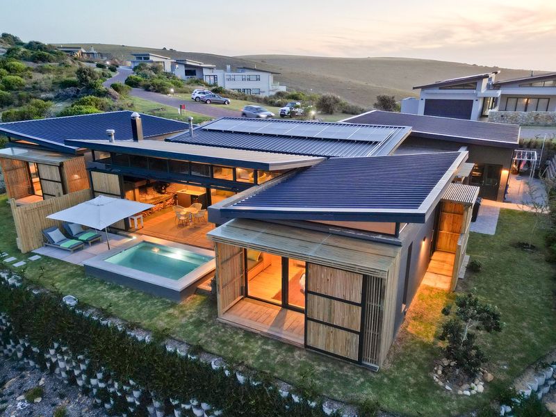 New Innovative Home Nurtured in Natural Stone and Wood - Photo 1