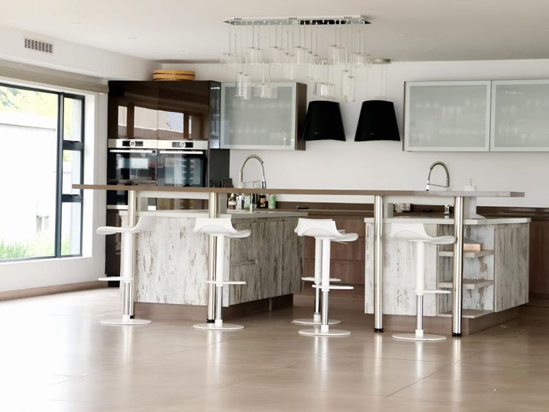 Front-Row Golf Course Living With River Views — Scandinavian- Contempary Luxury Home in Heron Banks - Photo 9