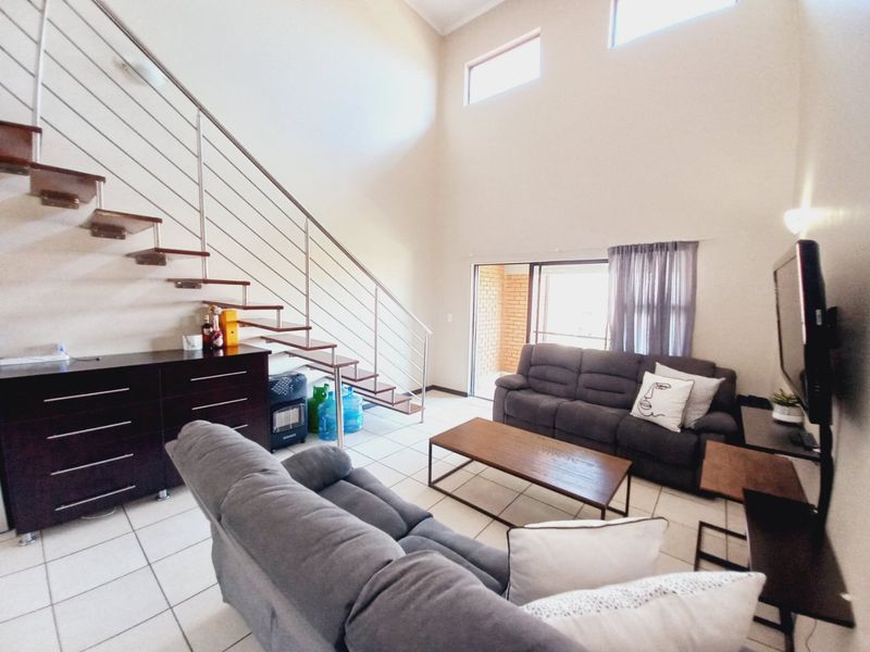 Immaculate Modern 3-Bedroom Loft Apartment Offering Space, Style, and Secure Estate Living - Photo 5