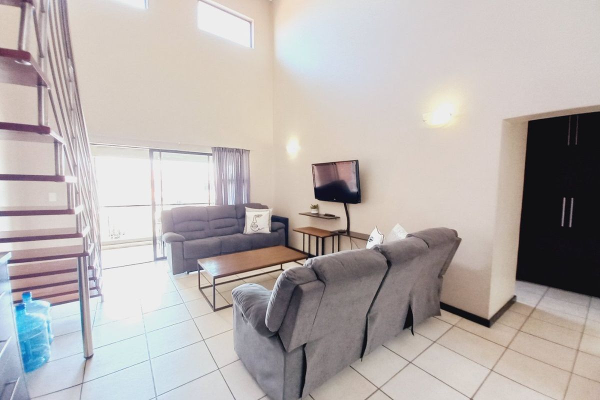 Immaculate Modern 3-Bedroom Loft Apartment Offering Space, Style, and Secure Estate Living - Photo 4