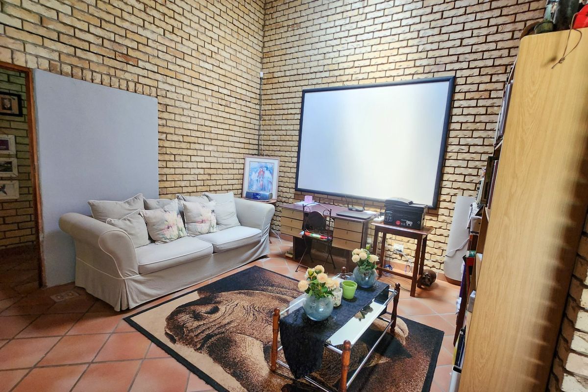 Spacious four bedroom family home with three bathrooms, a study, double garage, and a swimming pool, offering comfortable and practical living. - Photo 4