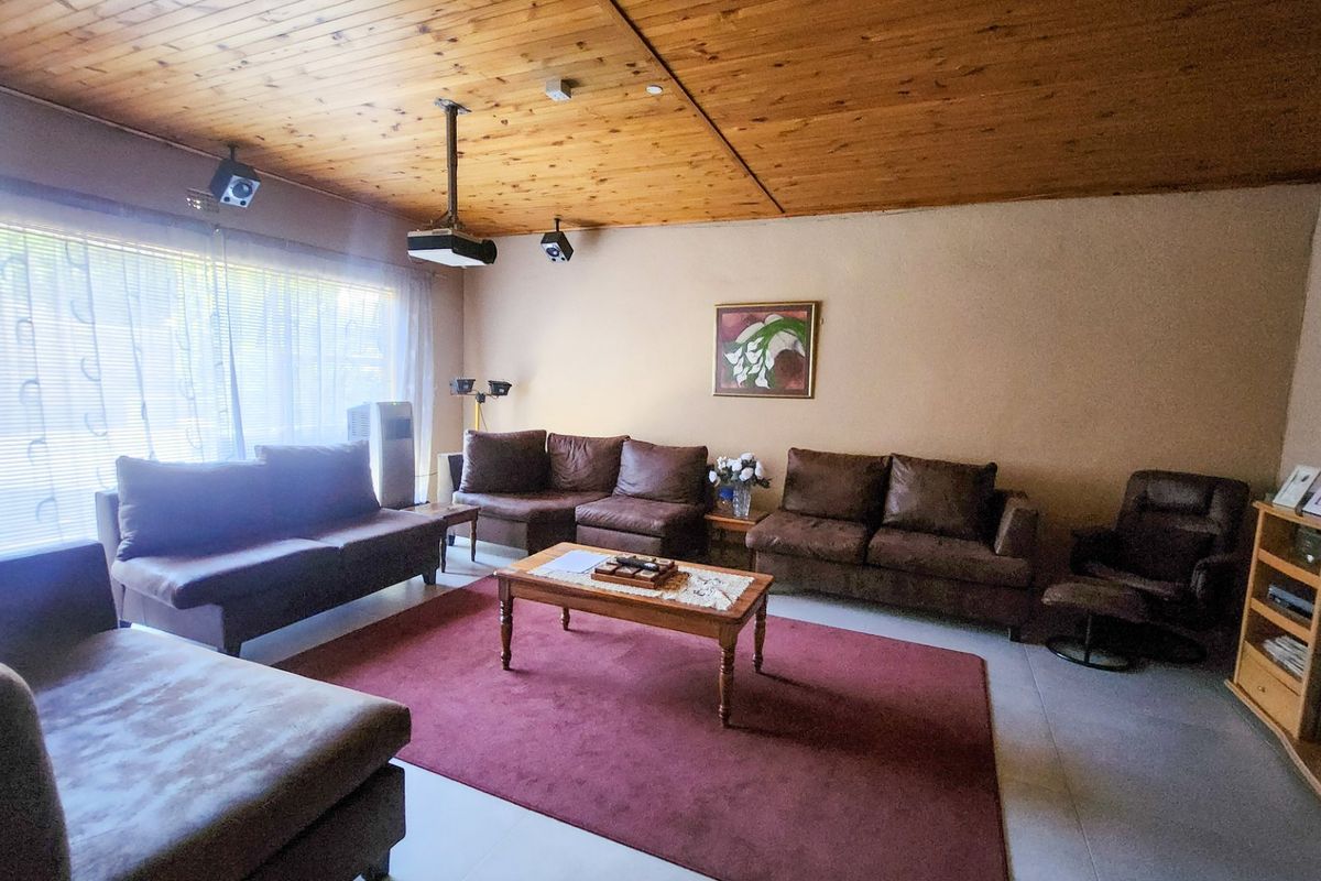 Spacious four bedroom family home with three bathrooms, a study, double garage, and a swimming pool, offering comfortable and practical living. - Photo 2