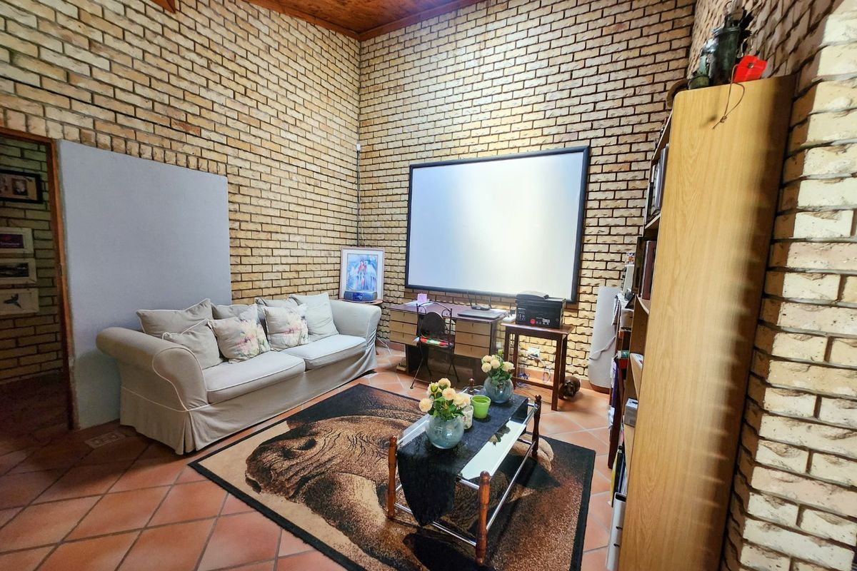 Spacious four bedroom family home with three bathrooms, a study, double garage, and a swimming pool, offering comfortable and practical living. - Photo 5