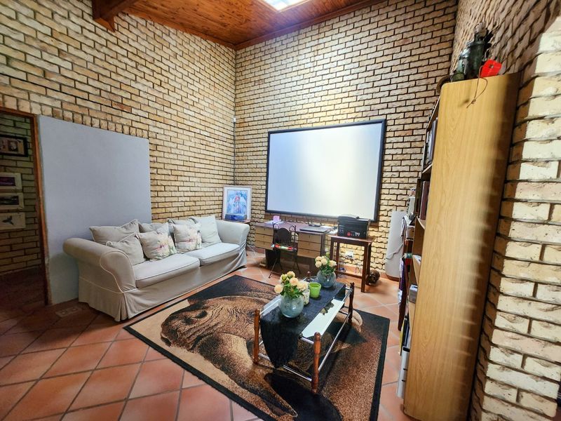 Spacious four bedroom family home with three bathrooms, a study, double garage, and a swimming pool, offering comfortable and practical living. - Photo 5