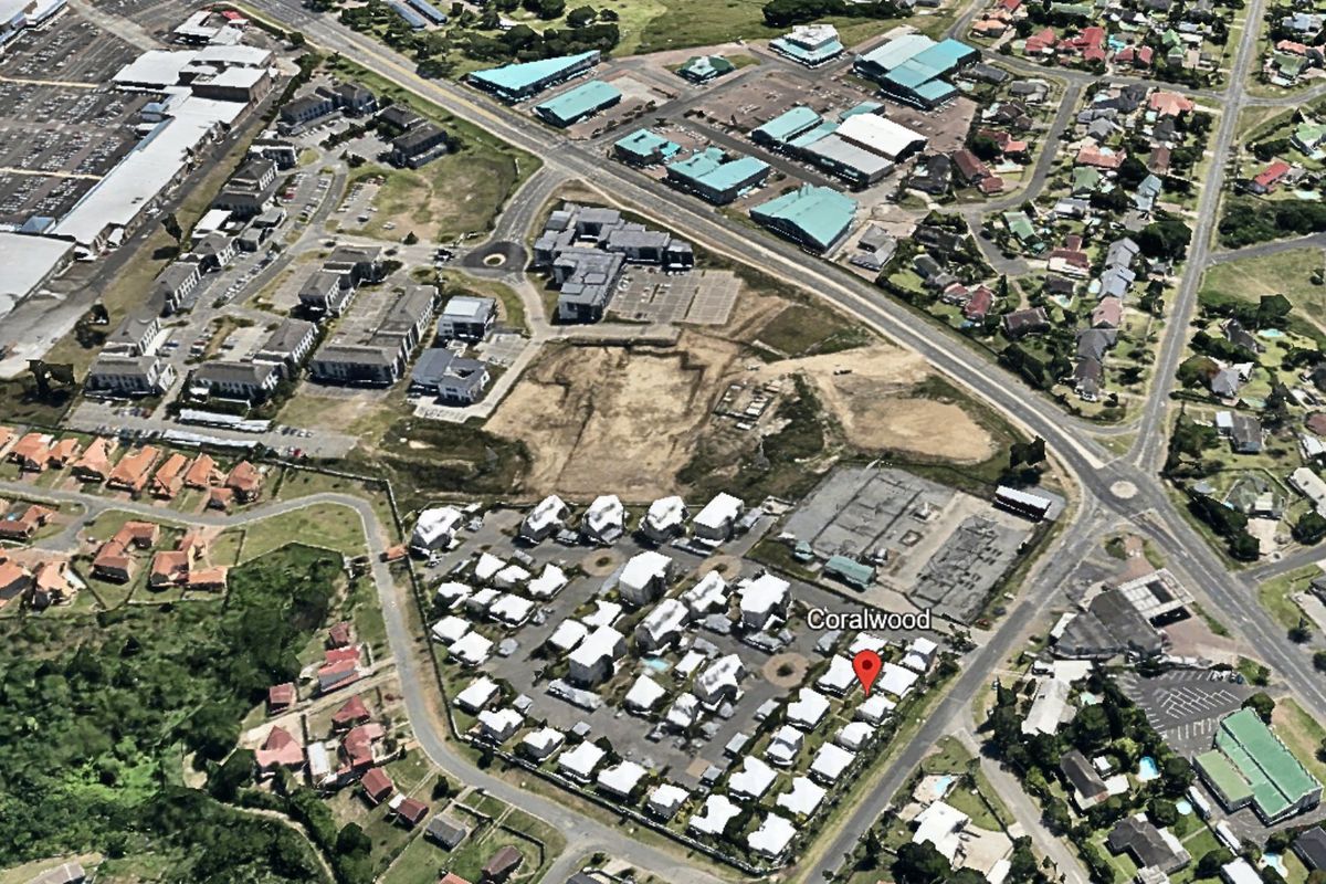 An aerial view showing the location of the Coralwood residential complex within the surrounding neighborhood and local infrastructure.