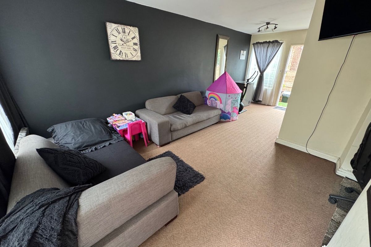 Comfortable Two-Bedroom Home with Practical Living Spaces - Photo 2