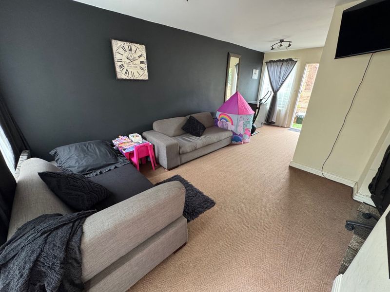 Comfortable Two-Bedroom Home with Practical Living Spaces - Photo 2