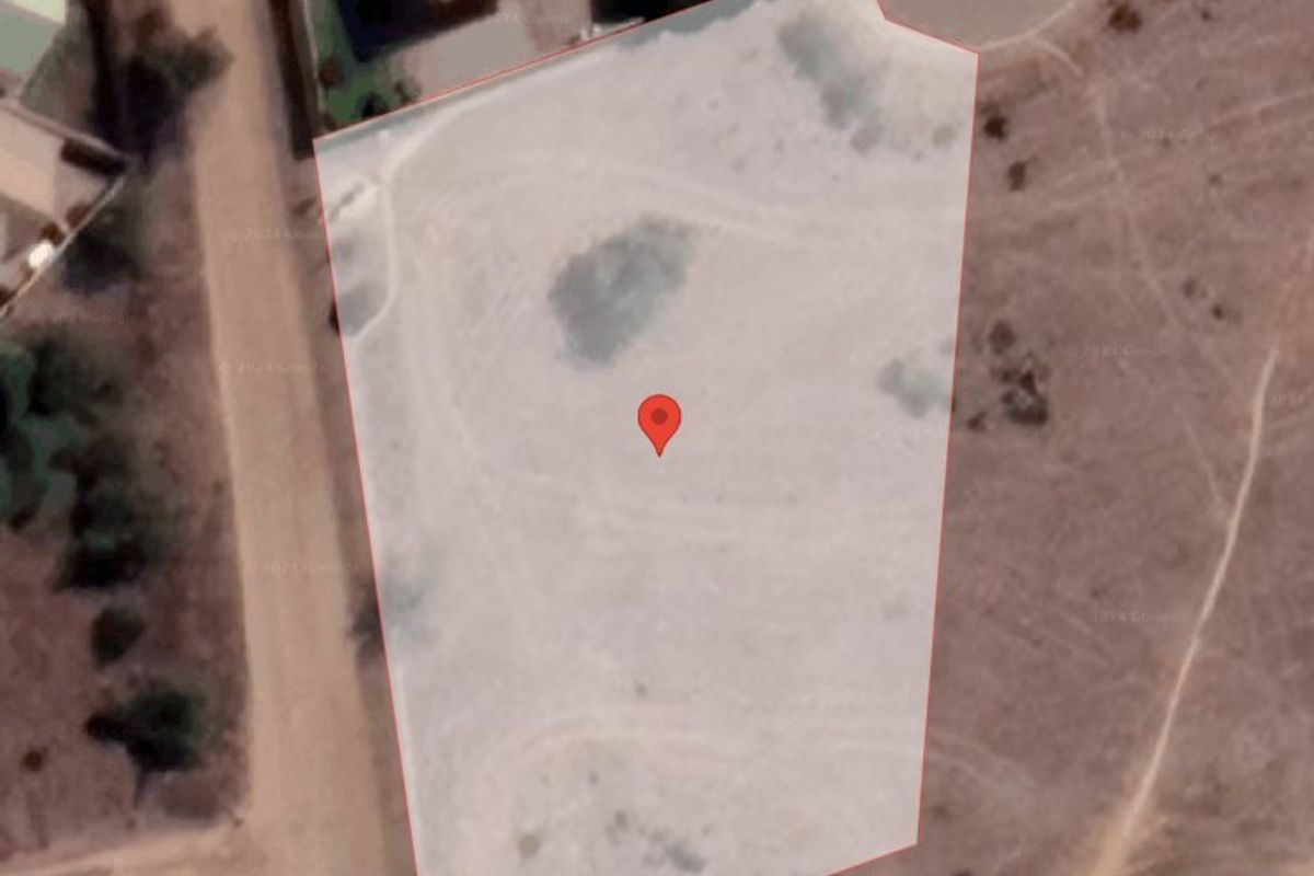 An aerial satellite view showing the boundaries of the vacant residential land plot.