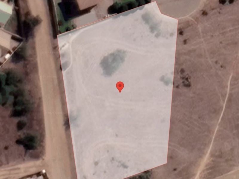 An aerial satellite view showing the boundaries of the vacant residential land plot.