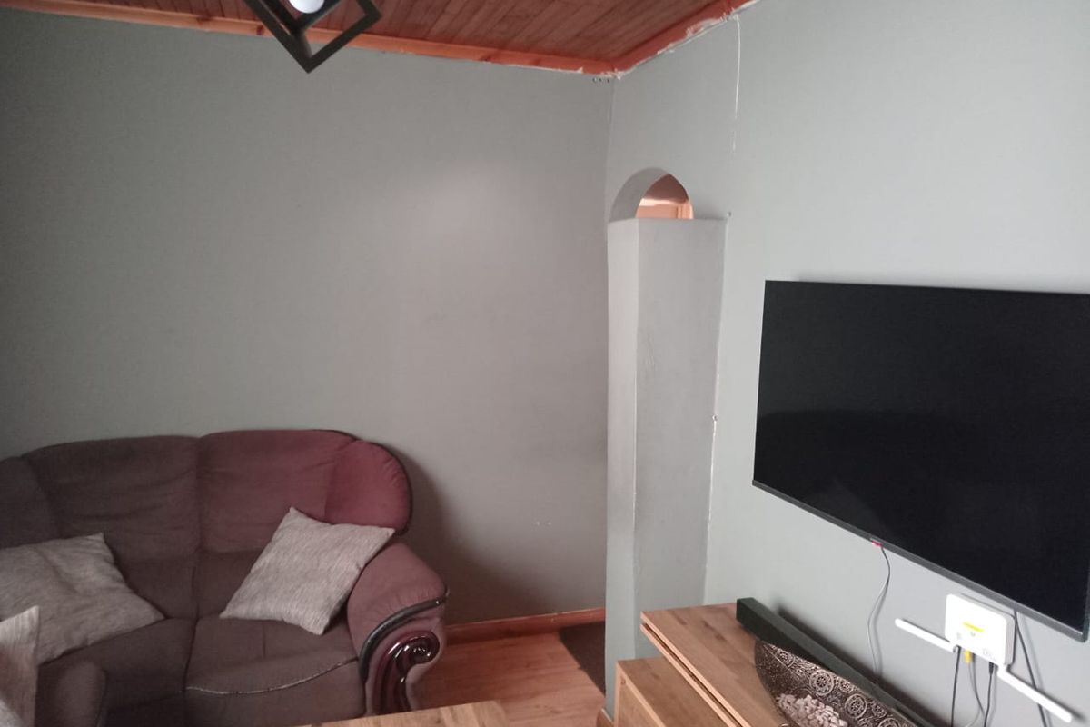 Secure 2 Bedroom Home with Garage and Great Potential - Photo 2