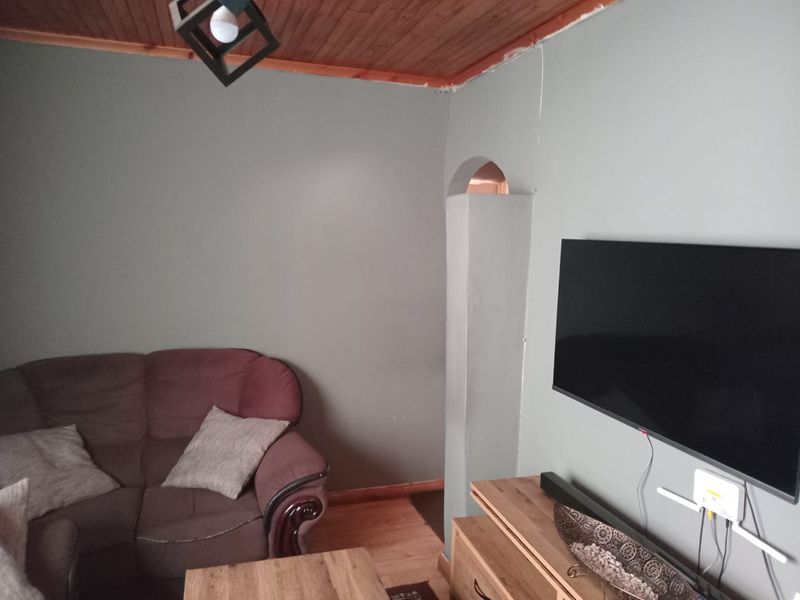 Secure 2 Bedroom Home with Garage and Great Potential - Photo 2