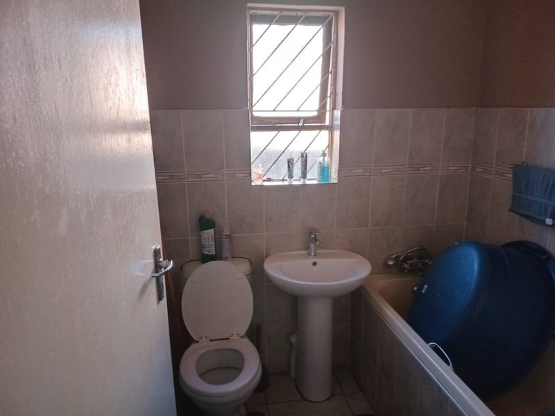 Secure 2 Bedroom Home with Garage and Great Potential - Photo 7