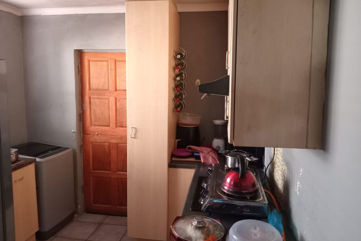 Secure 2 Bedroom Home with Garage and Great Potential - Photo 4