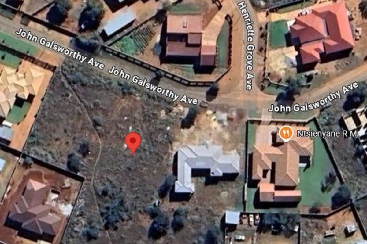 Aerial view of a vacant residential plot located at the corner of John Galsworthy Avenue and Henriette Grove Avenue.