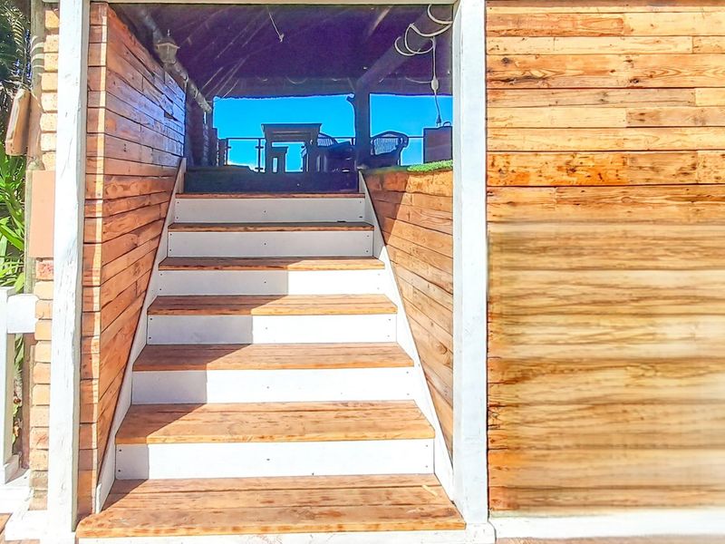 Thai-Inspired Coastal Luxury with Panoramic Sea Views -**PLUS Income x 3 Flats - Photo 10