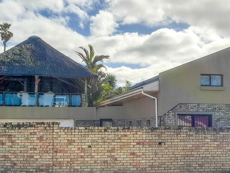 Thai-Inspired Coastal Luxury with Panoramic Sea Views -**PLUS Income x 3 Flats - Photo 1