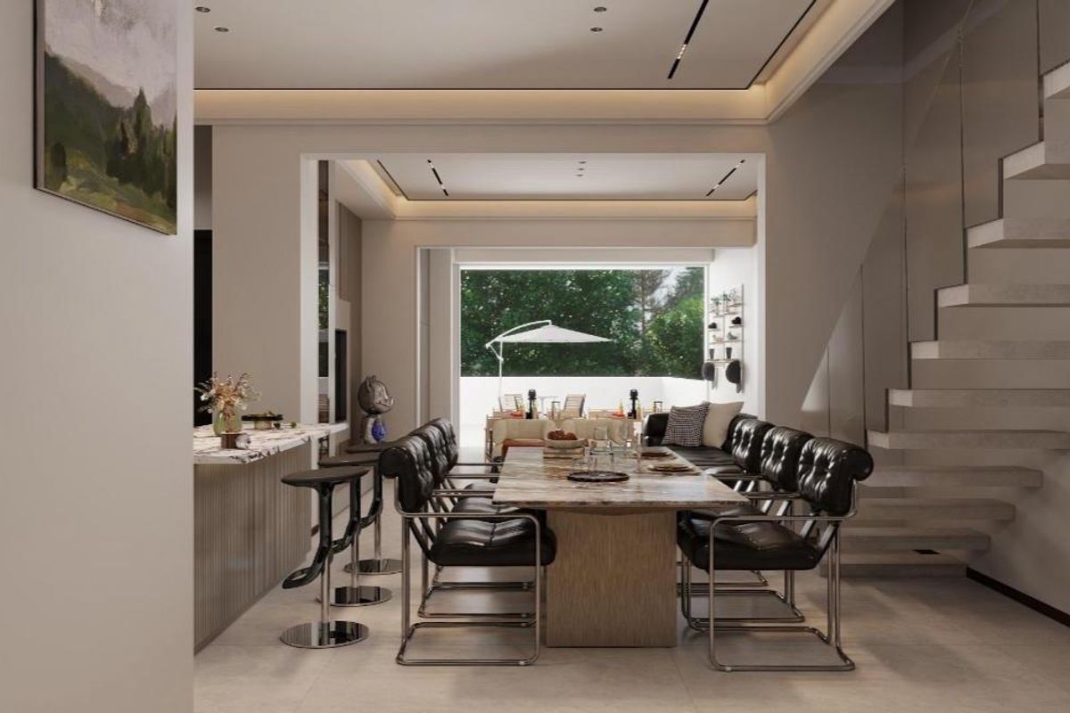 Modern open-plan living and dining area featuring a striking floating staircase, stone kitchen island, and seamless transition to an outdoor patio space.