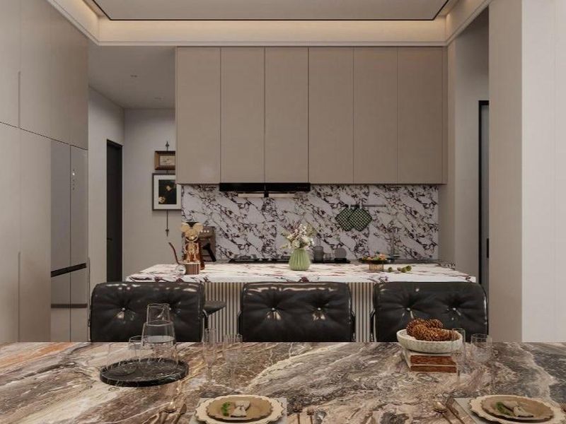 Modern kitchen featuring a marble island, matching marble backsplash, sleek built-in cabinetry, and integrated display shelving with recessed lighting.