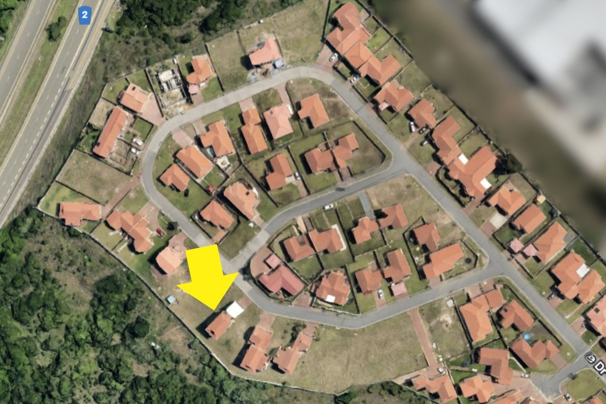An aerial satellite view of the residential townhouse complex, highlighting the property location within the estate layout.