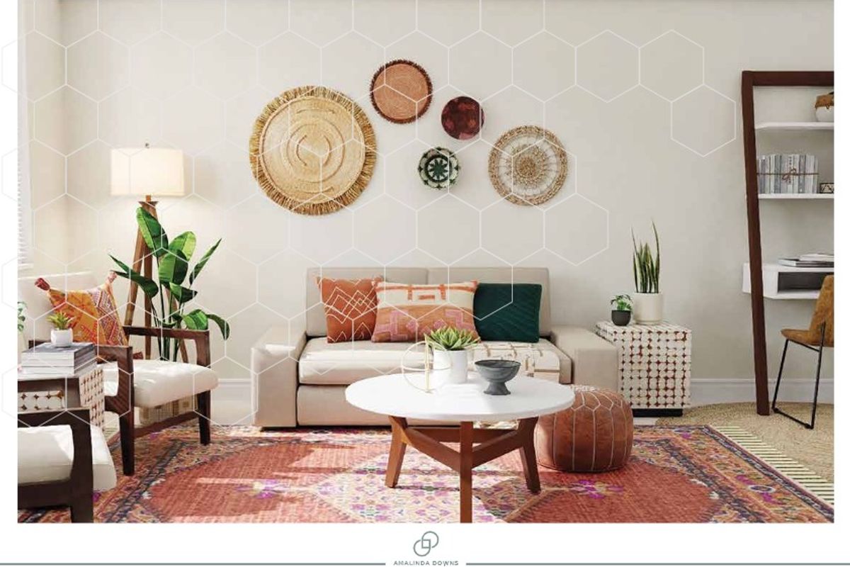 A well-lit living room featuring neutral walls and carpeted flooring, providing a comfortable and inviting space for relaxation.