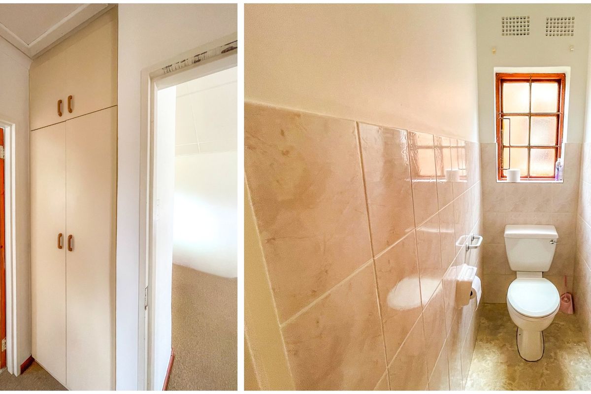 A compact bathroom featuring dated wall tiles, a standard toilet, and built-in storage cupboards in the adjacent hallway area.